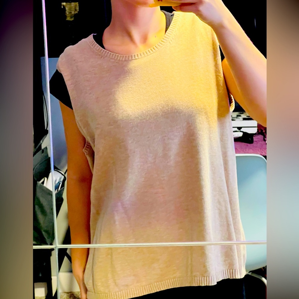 Light brown short sleeve vest; Cherokee.